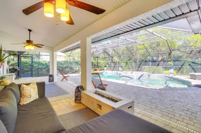 an indoor living room with a couch and a swimming pool at Near Parks and Lakes Sorrento Home with Pool and Yard! in Sorrento