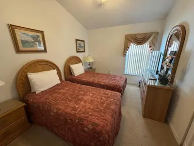 a hotel room with two beds and a window at Sunset Villa – Your Gateway to a Magical Florida Vacation! in Kissimmee