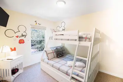 a bedroom with two bunk beds in a room at Flash 20 Off Amazing Pvt Pool Townhome in Kissimmee