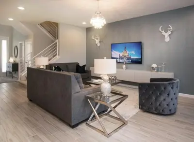 a living room with a couch and a table at Flash 20 Off Gorgeous Vacation Home near Everywhere in Kissimmee