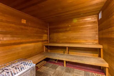 a wooden sauna with a bench in it at Flash 20 Off Spetacular TownHome With Private Pool close to Disney 8919PP in Kissimmee