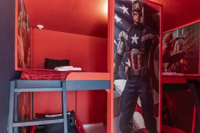a captain america bedroom with a captain america superhero poster at Sophisticated 9 bedroom close to Disney in Kissimmee