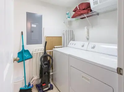 a white laundry room with a washer and dryer at Flash 20 Off Townhome at Emerald Island in Kissimmee