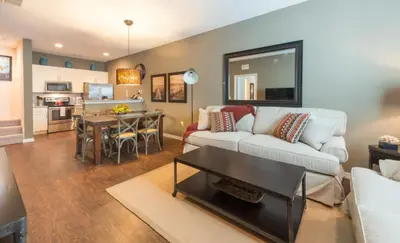a living room with a couch and a table at Special Offer Elegant Townhome at West Lucaya in Kissimmee