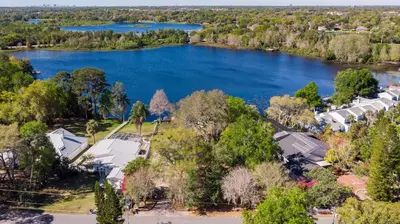 an aerial view of a lake with houses at Lakefront Retreat - Boat - Fish - Close to all Orlando Parks - Disney - Universal - SeaWorld in Orlando