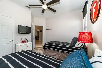 a bedroom with two beds and a ceiling fan at Special Offer Beautiful Pvt Pool home in Kissimmee