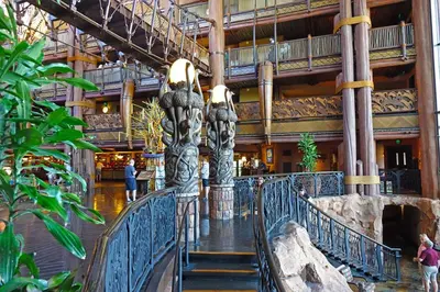 a walkway in a mall with a large building at Disney's Animal Kingdom Villas - Kidani Village in Orlando