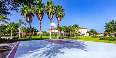 a basketball court in a park with palm trees at Special Offer Fantastic Townhome with Pvt Pool and Lake view near Disney in Kissimmee