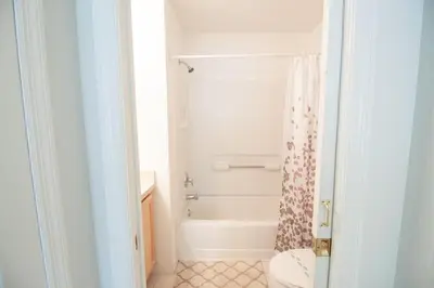 a bathroom with a shower and a toilet and a tub at Special Offer Private Pool Home at Seasons Community in Kissimmee