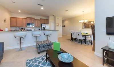 a living room with a kitchen and a dining room at Special Offer Pvt Pool Townhome in Kissimmee