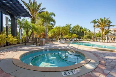 a small swimming pool in a courtyard next to a resort at Special Offer Stylish Apartment at Vista Cay Resort in Orlando