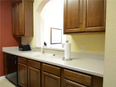 a kitchen counter with a sink and a window at Special Offer Stylish Apartment at Vista Cay Resort in Orlando
