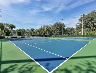 a tennis court with two tennis courts at New Luxury Disney Townhome at Windsor Hills Resort, 3BED 3BATH, Private Pool Parking WiFi Included in Orlando