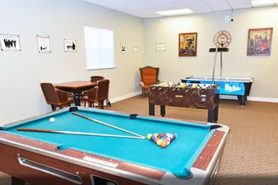 a billiard room with a pool table and a pool table at Special Offer Townhome at Oakwater Resort in Orlando