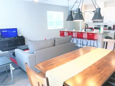 a living room with a couch and a table at TVPM5150CHCB in Kissimmee
