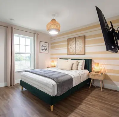 a bedroom with a bed and a television in it at New Listing - Modern decoration 4 BR Townhouse in Kissimmee