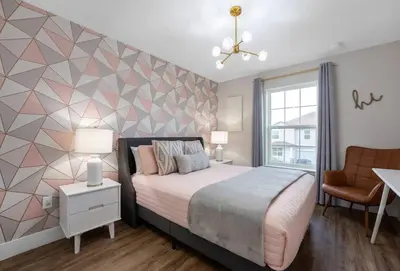 a bedroom with a bed and a geometric wall at New Listing - Modern decoration 4 BR Townhouse in Kissimmee