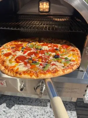 a pizza sitting on top of an oven at Disney Potter Condo FREE Shuttle & Parking in Orlando