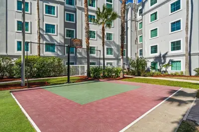 a basketball court in front of a building at Disney Potter Condo FREE Shuttle & Parking in Orlando