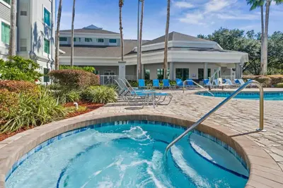 a pool at a resort with a swimming pool at Disney Potter Condo FREE Shuttle & Parking in Orlando