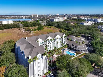 an aerial view of a building with a resort at Disney 1st floorEpicShuttle in Orlando