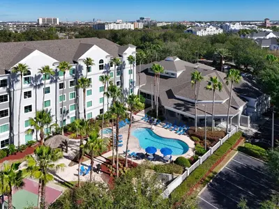 an aerial view of a hotel with a pool and resort at Disney 1st floorEpicShuttle in Orlando