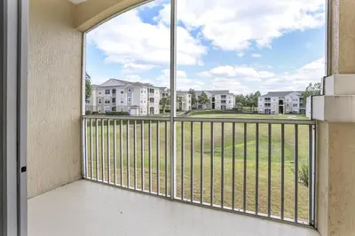 a balcony with a view of a building at 8102-3-PP-Vacation getaway condo at Windsor in Kissimmee