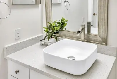 a bathroom with a white sink and a mirror at 8102-3-PP-Vacation getaway condo at Windsor in Kissimmee