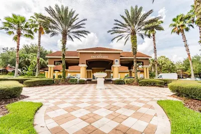 a house with palm trees in front of it at Cozy 3bd Townhouse Near Disney Encantada Resort in Kissimmee