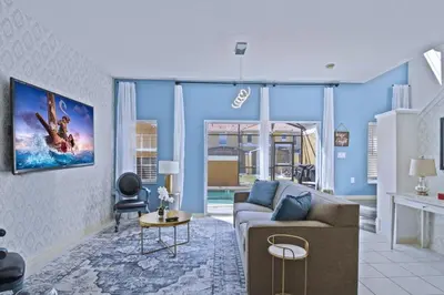 a living room with a couch and a table at Cozy 3bd Townhouse Near Disney Encantada Resort in Kissimmee