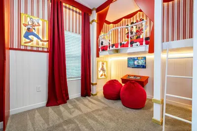 a childs room with red curtains and red bean bags at Vibrant 5Bd w Private Pool & Waterpark at Storey Lake 4811M in Kissimmee