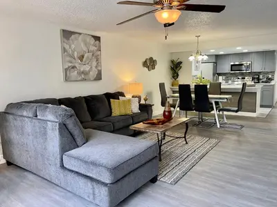 a living room with a couch and a table at Grand Superior 3BR Condo Apartment Near Disney Parks in Kissimmee