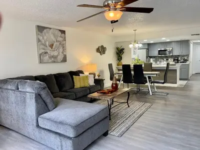 a living room with a couch and a table at Grand Superior 3BR Condo Apartment Near Disney Parks in Kissimmee