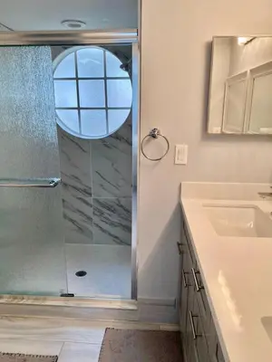 a bathroom with a shower with a glass door at Dream Superior 3BR Condo Near Disney Parks in Kissimmee
