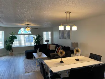 a living room with a couch and a table at Disney Superior 3BR Condo Near Theme Parks in Kissimmee