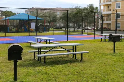a group of picnic tables in a park at King Room with Bathroom near Convention Center & Epic Universe in Orlando
