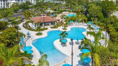 an aerial view of a pool at a resort at King Room with Bathroom near Convention Center & Epic Universe in Orlando