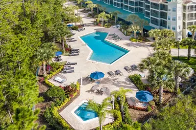 an overhead view of a pool at a resort at Upstay - Condo - Hot Tub & Pool in Orlando
