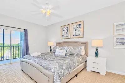 a bedroom with a bed and a window at Pet-Friendly - Upstay Condo w Pool Sauna in Orlando