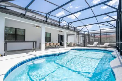 an indoor swimming pool with a glass ceiling at NEW Paradiso Grande Disney Themed Cinema5827 in Orlando