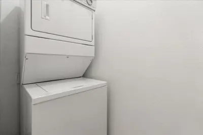 a white refrigerator with its door open in a kitchen at 2 Bedrooms 2 Bathrooms Secret Lake 3176-204 in Kissimmee