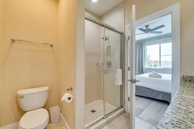 a bathroom with a shower and a toilet and a sink at Less Than 2 Mi to WDW Attractions Luxe Family Getaway! in Orlando