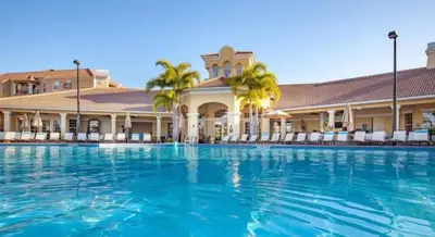 a large swimming pool in front of a hotel at Vista Cay Resort in Orlando