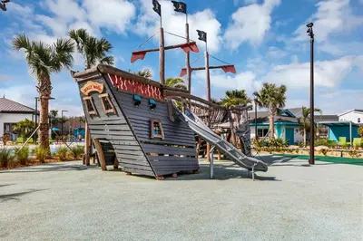 a playground with a slide in a park at Dream Vacation Home – Private Pool, Themed Rooms & Resort Access – ChampionsGate! in Kissimmee