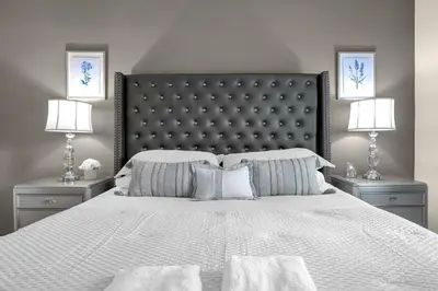 a bedroom with a large white bed with two lamps at Dluxx Perfect Townhouse next to Disney Parks 3204 in Kissimmee