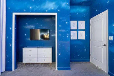 a blue room with stars on the wall at Brand New 5 Bedrooms4 Baths At Storey Lake in Kissimmee
