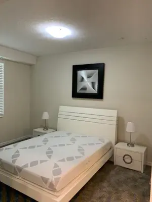 a bedroom with a large bed and two night stands at Aqua Vista Storey Lake in Kissimmee