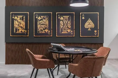 a table with chairs and a laptop on a wall at Brand NEW 12Bedrooms12Bathroom At Paradiso Grande in Orlando