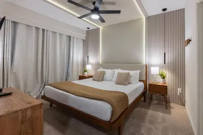 a bedroom with a bed and a ceiling fan at NEW Cozy 2 Bedrooms2Baths At Storey Lake in Kissimmee