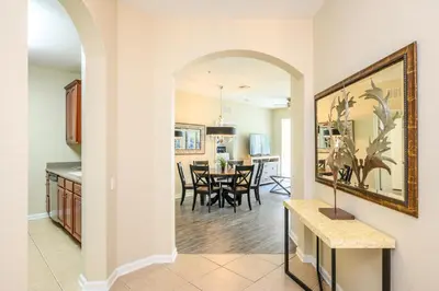 a kitchen and living room with a dining room at Epic Universe New Beautiful Condo, Vista Cay, Orlando - 3011 in Orlando